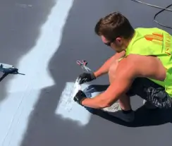 Commercial roofing expert performs roof repair