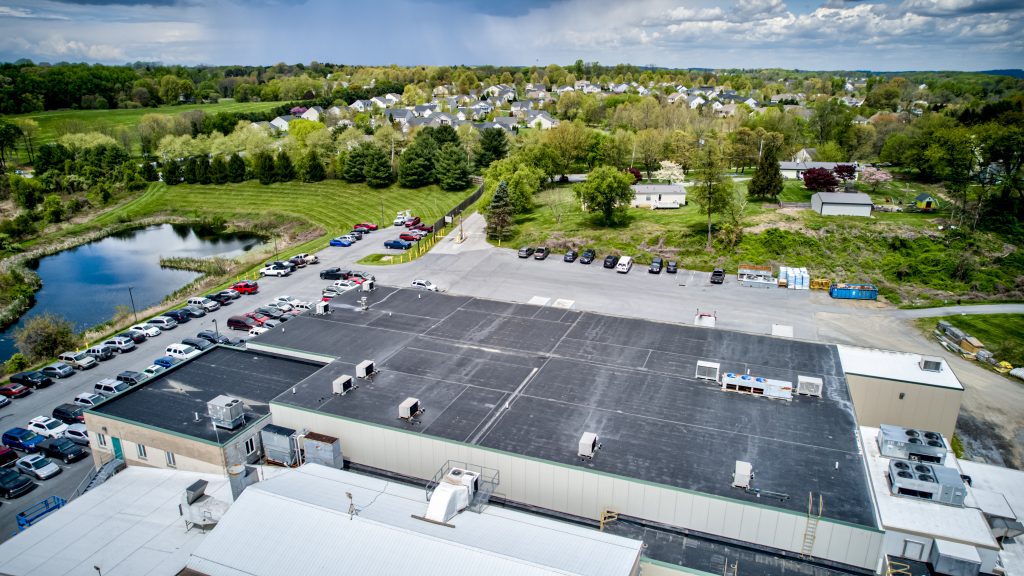 An areal view of an EPDM roof restoration