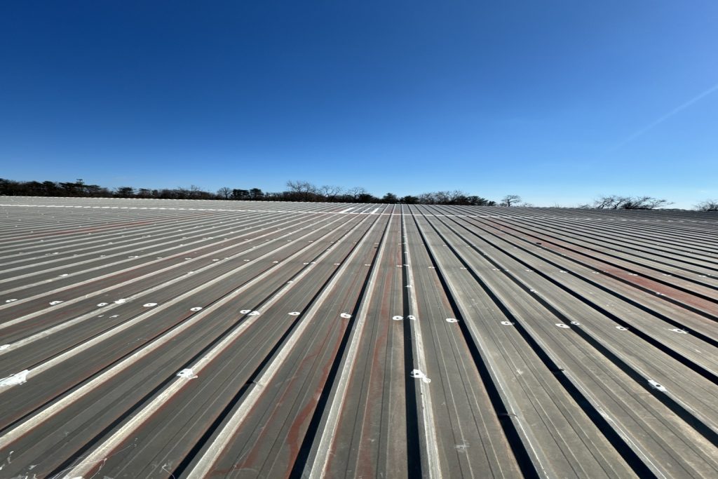 A metal roof photo taken as part of a commercial roof inspection checklist