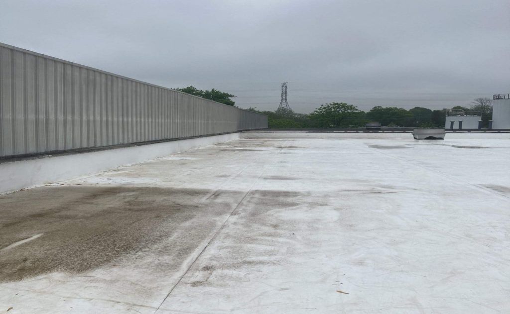 A TPO roof installation in reference to the question "How long does a TPO roof last?"